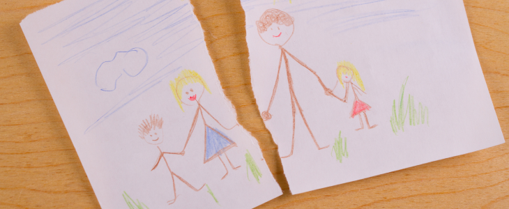 Drawing of a family, ripped in the middle to represent custody battle