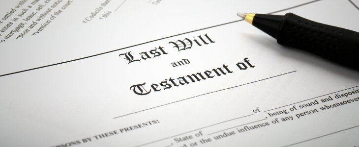 Last will and testament with a pen next to it