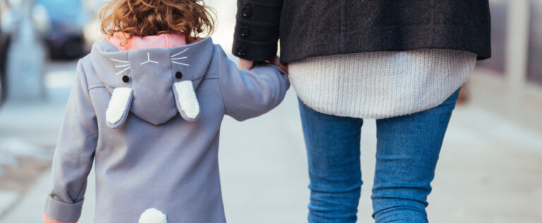 Mother and Daughter Walking together holding hands