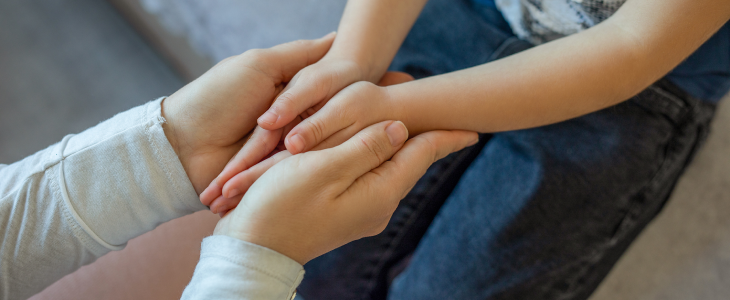 Mother consoling her son during a child custody dispute