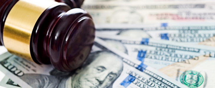 Cash with a gavel and mallet above it